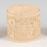 A circa 1900 Chinese relief carved ivory wrist sleeve, of deep form, the carved decoration depicting
