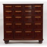 A 19th century and later adapted mahogany fruitwood pharmacy dispensary cabinet, arranged as four