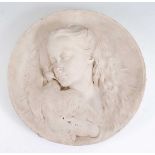 A marble wall plaque, of circular form, relief carved with a young girl and dove, initialled AJH and