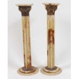 A pair of onyx and gilt metal mounted fluted torchere, 20th century, h.93cmCondition report: First