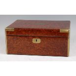 A good early 20th century amboyna and brass bound humidor, the hinged cover with cedar lined twin