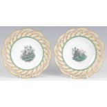 A pair of early 20th century Meissen porcelain cabinet plates, each having ribbon borders, the