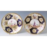 A pair of circa 1820 English porcelain footed bowls, each enamel decorated with floral reserves