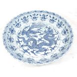 A Chinese export blue and white decorated stoneware shallow bowl, of good size, having a lobed