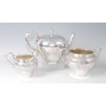 A William IV silver three-piece teaset, comprising teapot, twin handled sugar, and cream, each