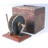 A 19th century rotary cleaning tool, having a 14cm brass rotating drum with 15mm tapering