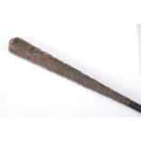 A circa 1900 Indian embossed silver capped and ebony walking cane, the tapering long handle