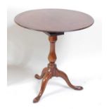 A 19th century mahogany pedestal tilt-top tripod table, having birdcage action, bearing plaque for