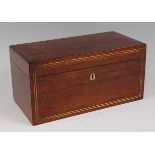 A Regency rosewood and brass strung tea caddy, having a fitted interior, with centre glass mixing