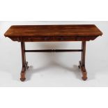 *A William IV rosewood sofa table, having twin frieze drawers opposing dummy drawers, and raised