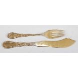 An American sterling silver gilt eight-place setting of fish knives and forks, by Shreve, Crump &