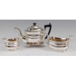 A George III silver four-piece tea service, comprising teapot with stand, twin handled sugar and