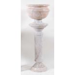 A contemporary veined white marble pedestal torchere, with accompanying jardinière, each with turned