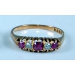 An early 20th century 18ct yellow gold, ruby and diamond half hoop eternity ring, with three