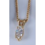 An 18ct yellow gold single stone marquise cut diamond pendant, with four claw setting and split