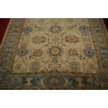 A Turkish Ushak woollen carpet, the cream ground decorated with stylised flowers and foliage