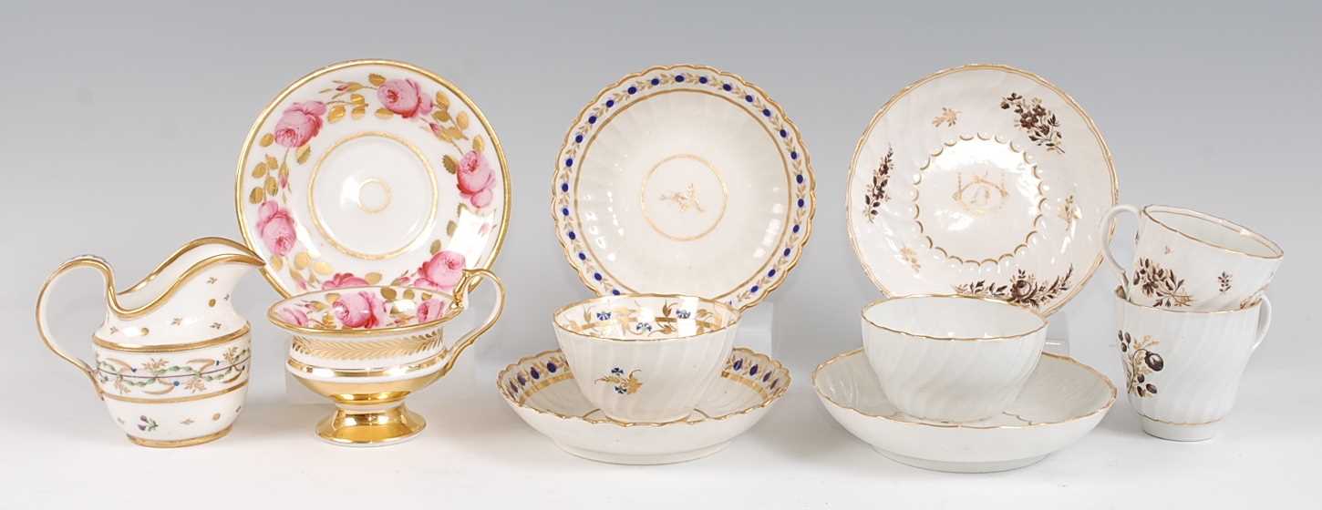 Assorted principally early 19th century English porcelain tea bowls and teacups on stands, to