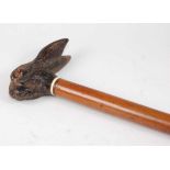 A Victorian malacca walking cane, the handle well-carved as a hare's head and ears in unidentified