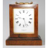 A late 19th century rosewood cased carriage clock, the white enamel dial signed by the retailer '