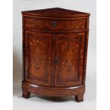 *A 19th century Dutch walnut and floral marquetry bowfront freestanding corner cupboard, having