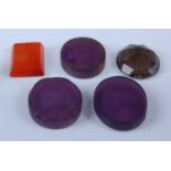 A group of five intaglio engraved glass 'Tassie gems', circa 1800, including three amethyst coloured