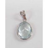 A white metal and aquamarine pendant, the oval aquamarine measuring approx 11.4 x 8.6 x 1.15mm,