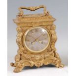 A mid-19th century French gilt bronze mantel clock, in the Louis XIV taste, with swing carry handle,