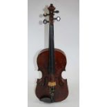 An early 20th century Czechoslovakian violin, having a two piece back, ebony finger board and mother