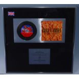Guns N' Roses, a presentation CD for the album The Spaghetti Incident? with plaque below "