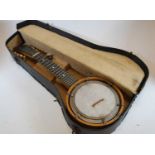 A mid-20th century walnut eight string banjo, cased, together with one other banjo, a lute, a