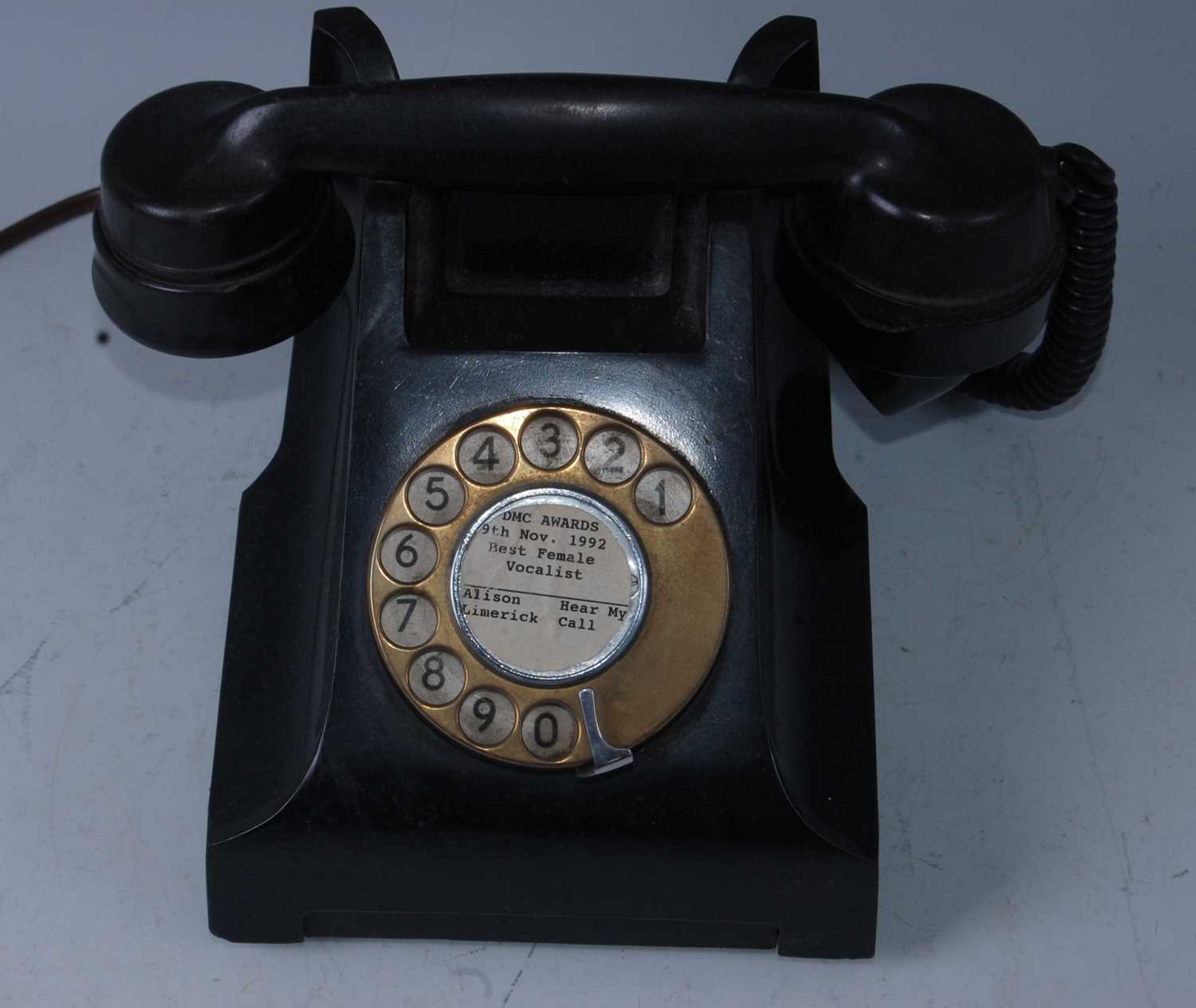 A bakelite telephone, the centre of the dial printed DMC Music Awards 9th Nov. 1992 Best Female