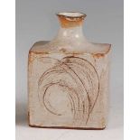 A possibly Japanese slab-sided studio pottery bottle shaped vase, the opposing panels with incised