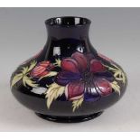 A large contemporary Moorcroft squat vase, in the Anemone pattern, typically tube-line decorated and