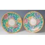 Charlotte Rhead for Crown Ducal - a pair of 1930s pottery chargers, each bright colour underglaze