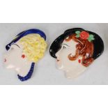 Two Moorland glazed ceramic wall masks, each underglazed painted and stylised female profile bust