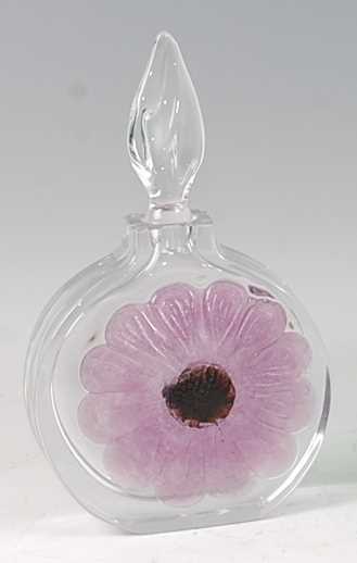 A contemporary Daum Nancy heavy clear glass perfume bottle and stopper, of circular slab-sided form,