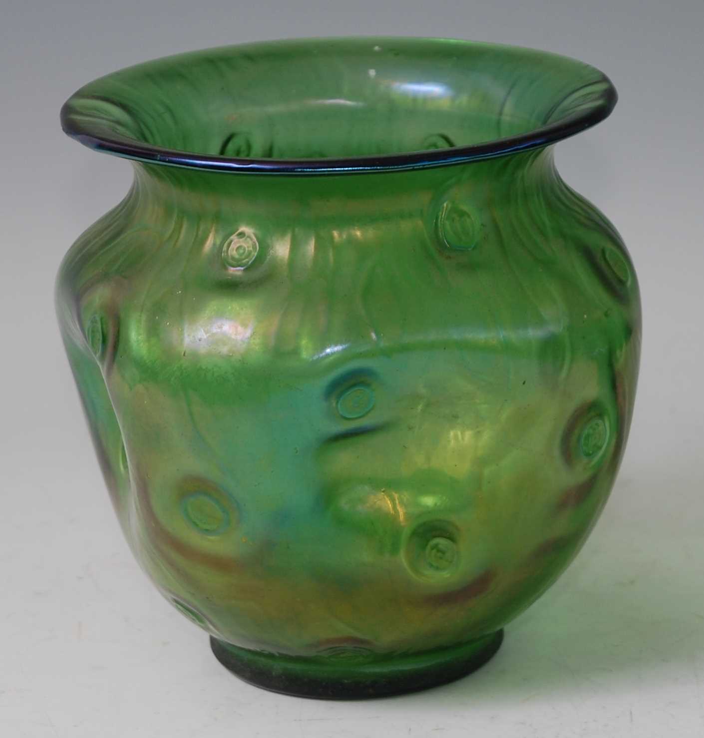 A possibly Loetz early 20th century green glass vase, the everted rim over pinched body, with