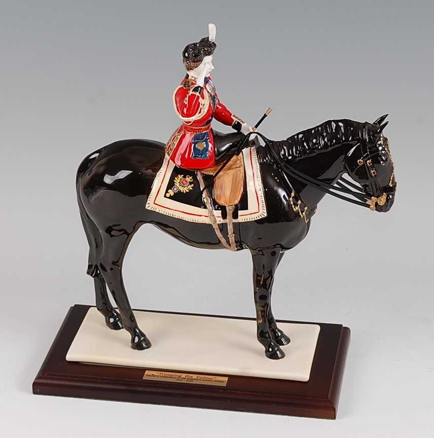 A Coalport limited edition figurine 'Trooping the Colour', underglaze painted and heightened in