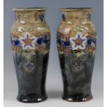 A pair of large circa 1900 Royal Doulton glazed stoneware vases, each of slightly shouldered slender