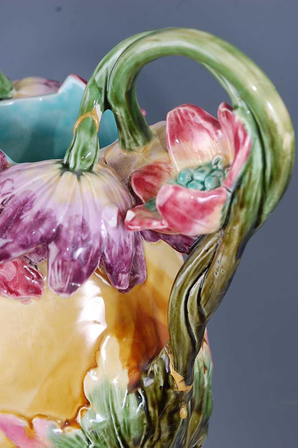 A pair of large Art Nouveau majolica glazed pottery twin handled figural vases, with profusely - Image 3 of 6