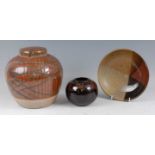 A large studio pottery ginger jar and cover, Tenmoku glazed and of shouldered bulbous form,