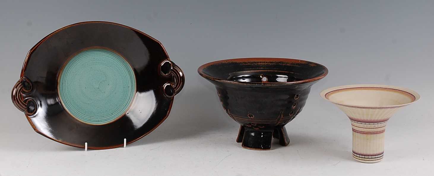 A Japanese studio pottery twin handled shallow table bowl, having brown Tenmoku glaze, painted