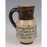 A Martin Brothers stoneware single handled wine pitcher, the body inscribed 'Welcome my friende,