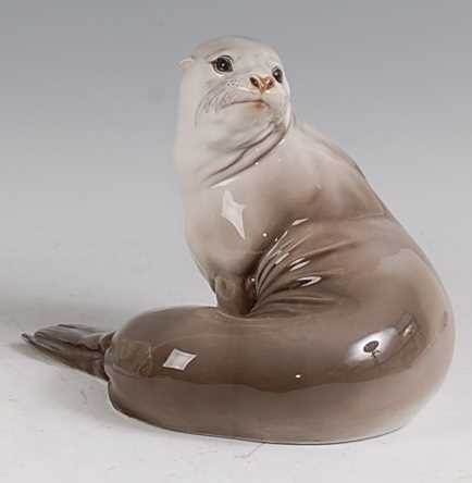 Theodor Kärner for Rosenthal - a glazed porcelain model of a Seal, in recumbent pose looking
