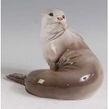 Theodor Kärner for Rosenthal - a glazed porcelain model of a Seal, in recumbent pose looking