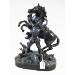 A 19th century spelter model of a huntsman with rearing horse, on a wooden plinth, h.36cm