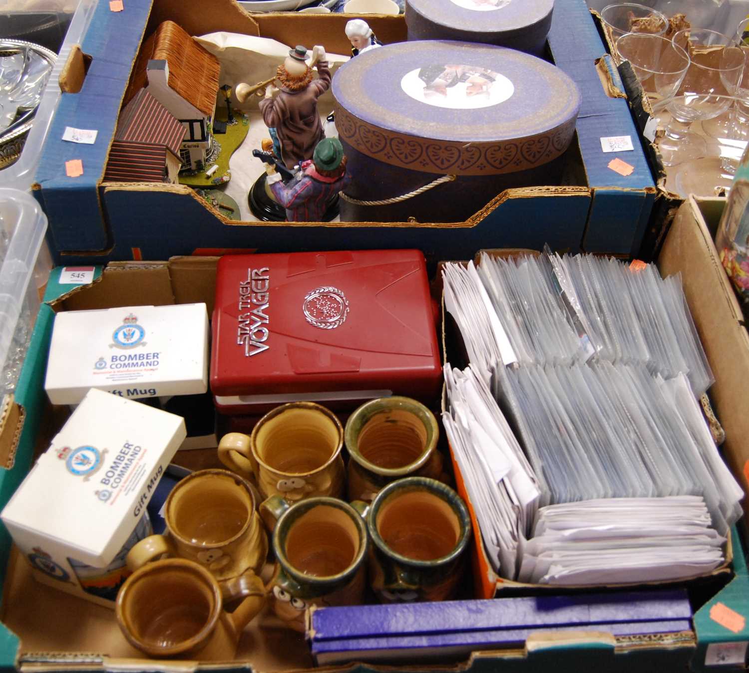 Two boxes of miscellaneous items to include Royal Air Force Bomber Command memorial appeal mugs,