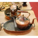 A Victorian copper watering can; together with a large 19th century copper saucepan; a copper