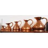 A set of five 19th century graduated copper measures, the largest h.40cmCondition report: Colour
