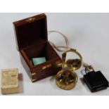 A reproduction brass cased pocket compass in fitted brass bound box together with a TG & Co. Ltd